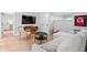 Comfortable living room featuring modern furnishings, a plush white sofa, and stylish decor at 1207 S Druid Ln, Tampa, FL 33629