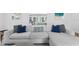 Bright living room with an oversized sectional, stylish decor, and lots of natural light at 1207 S Druid Ln, Tampa, FL 33629