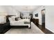 Spacious primary bedroom features neutral tones, an elegant chandelier, and plantation shutters at 1207 S Druid Ln, Tampa, FL 33629