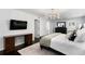 Well-lit main bedroom with a cozy bed, dark furniture, and private ensuite for ultimate relaxation at 1207 S Druid Ln, Tampa, FL 33629