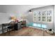 Bright office with desk space, natural light from shuttered windows, and wood floors at 1207 S Druid Ln, Tampa, FL 33629