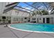 Expansive backyard featuring a large pool, covered patio, and outdoor kitchen for ultimate outdoor living at 1207 S Druid Ln, Tampa, FL 33629