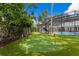 Beautifully landscaped backyard featuring a manicured putting green with flags for a touch of recreation at 1207 S Druid Ln, Tampa, FL 33629