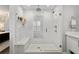 Modern walk-in shower with dual shower heads, bench, glass enclosure, and white subway tiles at 1207 S Druid Ln, Tampa, FL 33629