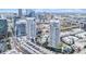 Aerial view of two modern high-rise towers with pool and amenity spaces in an urban setting at 1209 E Cumberland Ave # 2006, Tampa, FL 33602
