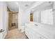 Well-lit bathroom featuring a glass-enclosed shower and a vanity with plenty of storage space at 1209 E Cumberland Ave # 2006, Tampa, FL 33602