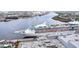 An impressive cruise ship is docked near industrial structures and lush green vegetation along the water at 1209 E Cumberland Ave # 2006, Tampa, FL 33602