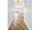 Bright hallway featuring beautiful hardwood floors that lead to an open living space with expansive windows at 1209 E Cumberland Ave # 2006, Tampa, FL 33602