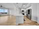 Modern white kitchen with stainless steel appliances, quartz countertops, and hardwood floors at 1209 E Cumberland Ave # 2006, Tampa, FL 33602