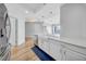 Bright kitchen featuring a large island with sink, stainless dishwasher, and open layout to the living area at 1209 E Cumberland Ave # 2006, Tampa, FL 33602