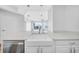 Lovely open concept kitchen with stainless appliances, white cabinetry, and views of the living room at 1209 E Cumberland Ave # 2006, Tampa, FL 33602