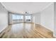 Bright, open living room with hardwood floors, ceiling fan, and expansive windows offering stunning views at 1209 E Cumberland Ave # 2006, Tampa, FL 33602
