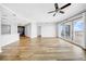 Open concept living area with hardwood floors, recessed lights, and sliding doors to a balcony with amazing views at 1209 E Cumberland Ave # 2006, Tampa, FL 33602