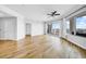 Inviting living room features hardwood floors, recessed lighting, ceiling fan, and sliding glass doors to a balcony at 1209 E Cumberland Ave # 2006, Tampa, FL 33602