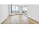 Bright living room with wood floors and beautiful water views from the large windows and access to balcony at 1209 E Cumberland Ave # 2006, Tampa, FL 33602