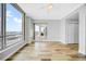 Spacious living room with beautiful flooring, a ceiling fan, and expansive windows boasting stunning city views at 1209 E Cumberland Ave # 2006, Tampa, FL 33602