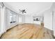 Modern living space boasts hardwood floors, recessed lights, and large windows with a view, open to the kitchen at 1209 E Cumberland Ave # 2006, Tampa, FL 33602