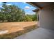 View of the backyard and trees from under the covered patio at 12256 Creek Preserve Dr, Riverview, FL 33579