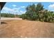 A spacious backyard with trees and grass is fenced in at 12256 Creek Preserve Dr, Riverview, FL 33579