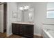 Granite vanity with updated fixtures in a well-lit bathroom at 12256 Creek Preserve Dr, Riverview, FL 33579