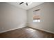 A cozy bedroom has wood flooring and a sunny window view at 12256 Creek Preserve Dr, Riverview, FL 33579