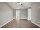 Bedroom with hardwood floors, tray ceiling, and neutral paint at 12256 Creek Preserve Dr, Riverview, FL 33579