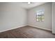 A cozy bedroom has wood flooring and a sunny window view at 12256 Creek Preserve Dr, Riverview, FL 33579