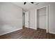 Bedroom showcasing wood floors, closet, and doorway to hall at 12256 Creek Preserve Dr, Riverview, FL 33579