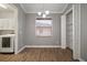 Well-lit dining area featuring wood flooring and a modern chandelier at 12256 Creek Preserve Dr, Riverview, FL 33579