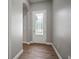 Inviting foyer featuring a decorative glass front door and attractive wood-look flooring at 12256 Creek Preserve Dr, Riverview, FL 33579