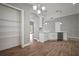 Spacious kitchen area with white cabinets, modern appliances, hardwood flooring, and pantry at 12256 Creek Preserve Dr, Riverview, FL 33579