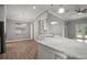 Well-appointed kitchen with granite counters, white cabinets, and stainless steel sink at 12256 Creek Preserve Dr, Riverview, FL 33579