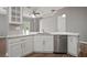 Bright kitchen with white cabinetry, granite countertops, and stainless steel dishwasher at 12256 Creek Preserve Dr, Riverview, FL 33579
