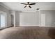 Large living room with wood flooring and modern ceiling fan at 12256 Creek Preserve Dr, Riverview, FL 33579