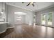 Spacious living room with wood flooring and large glass patio doors at 12256 Creek Preserve Dr, Riverview, FL 33579