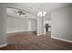 Spacious living room with hardwood floors, neutral paint, and decorative archways to other rooms at 12256 Creek Preserve Dr, Riverview, FL 33579