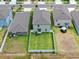 Backyard aerial view, showcasing lush lawns, fenced yards, and residential neighborhood at 12715 Maple Bonsai Dr, Riverview, FL 33579