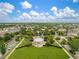 Community aerial view featuring a central gazebo surrounded by lush greenery and well-maintained homes at 12715 Maple Bonsai Dr, Riverview, FL 33579