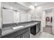 Bathroom with double vanity, granite countertop, and walk-in closet at 12715 Maple Bonsai Dr, Riverview, FL 33579