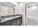 Bathroom with double vanity, granite countertop, and a tub and shower combo at 12715 Maple Bonsai Dr, Riverview, FL 33579