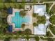 Aerial shot of a well-maintained community pool and clubhouse, providing leisure and social opportunities at 12715 Maple Bonsai Dr, Riverview, FL 33579