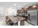 Kitchen features a large center island, stainless steel appliances, and ample cabinet space at 12715 Maple Bonsai Dr, Riverview, FL 33579