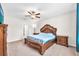 Main bedroom featuring a decorative headboard and ceiling fan at 12715 Maple Bonsai Dr, Riverview, FL 33579