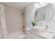 Bright bathroom with modern fixtures, white vanity, and shower and tub combination at 138 69Th N Ave, St Petersburg, FL 33702