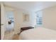 Bedroom view with wood-look flooring, neutral paint, and access to the living area at 138 69Th N Ave, St Petersburg, FL 33702