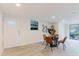 Inviting dining area with a round table, four chairs, and a decorative plant, perfect for casual meals at 138 69Th N Ave, St Petersburg, FL 33702