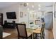 Bright and airy dining area with a modern light fixture, seamlessly connecting to the living room and the kitchen at 138 69Th N Ave, St Petersburg, FL 33702