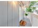 Inviting entrance featuring a 'HOME' doormat, decorative glass door, exterior lighting, and potted plant for a warm welcome at 138 69Th N Ave, St Petersburg, FL 33702