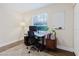 Bright home office featuring a desk, computer setup, and a whiteboard for a productive workspace at 138 69Th N Ave, St Petersburg, FL 33702