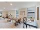 Bright and airy living area with two chairs, side tables, and large windows offering natural light at 138 69Th N Ave, St Petersburg, FL 33702